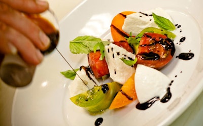 The focus is on fresh, high-quality ingredients like the vintage tomatoes, mozzarella di bufala, and organic basil in the caprese rustica.