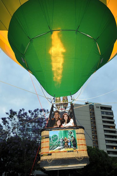 An Emerald City-inspired green balloon floated 75 feet high at The Wizard of Oz press stunt.