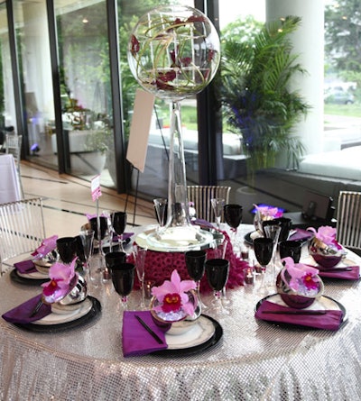 The winner in the innovation category, Rick Davis of Amaryllis Inc. relied on a glittering mirrored linen edged with purple feathers and a rotating glass globe filled with purple calla lilies.