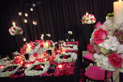 Tierra Floral Design's table used masses of hydrangea and roses for tabletop and candle treatments.