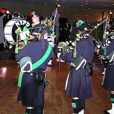 The New York Police Department Emerald Society Pipes and Drums corps called eventgoers into the ballroom from the cocktail area.