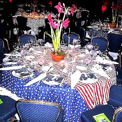 Dinner tables were decorated with American flag-patterned tablecloths and red potted amaryllis from Zeze Flowers.