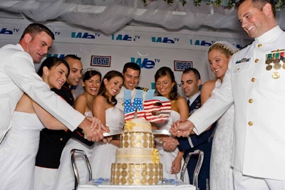 The cake, topped with a WE TV sign, also doubled as a promotion for the network's Amazing Cakes show.