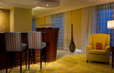 Presidential suites have free-standing bars with seating.