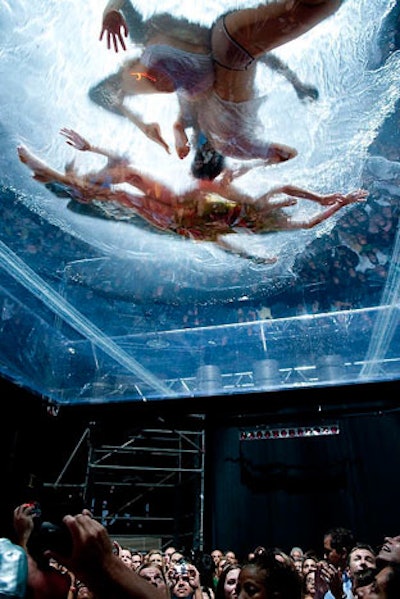 Dancers performed in a swimming pool suspended over the audience.