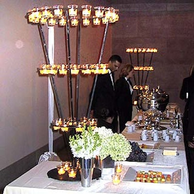Avi Adler decorated the buffet tables with large black wrought-iron candelabras, and huge flower arrangements surrounded by smaller bouquets of white tulips, roses and freesia.