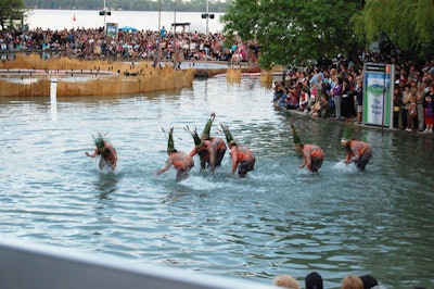 Cirque du Soleil performers splashed around in the pond behind York Quay Centre during the performance, which was the first of several free shows held throughout Luminato's closing weekend.