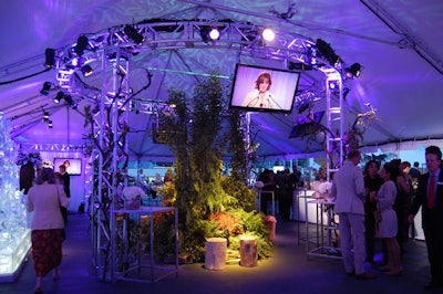 Event producers 43 Degrees used greenery to fill the nature-inspired tent, which overlooked the pond where Cirque du Soleil performed.