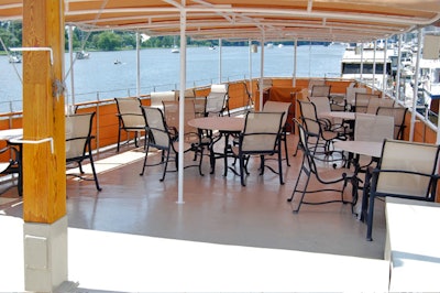 When combined, the covered upper deck and the lower main salon can accommodate 100 guests.