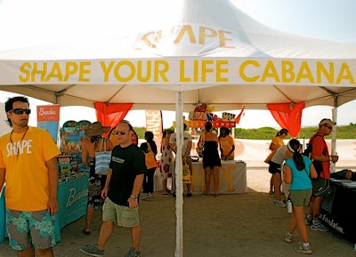 Cabanas named after the magazine's editorial sections, like Shape Your Life and Get Fit, dotted the beach.