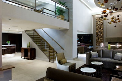 The main lobby leads to a mezzanine level with two meeting rooms.