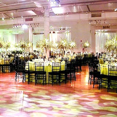 For the Studio Museum in Harlem's benefit gala at the Metropolitan Pavilion, Daily Blossom's green decor scheme included cymbidium orchid centerpieces and green lights by Stortz Lighting.