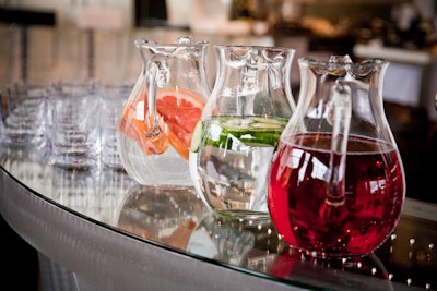 Glass pitchers filled with grapefruit- and cucumber-flavoured water topped one of three bars in the showroom.