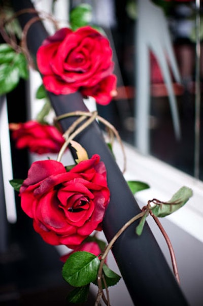 Event organizers paid homage to Guns N' Roses by wrapping red roses and twine around railings.