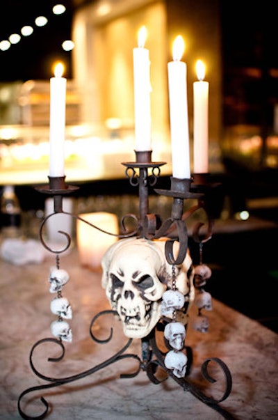 Skulls adorned the black candelabra that topped the bar.
