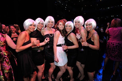 The National Ballet's special events coordinator, Kristina Evans, posed with raffle ticket sellers—dressed in black and wearing white wigs—at the post-dinner reception.