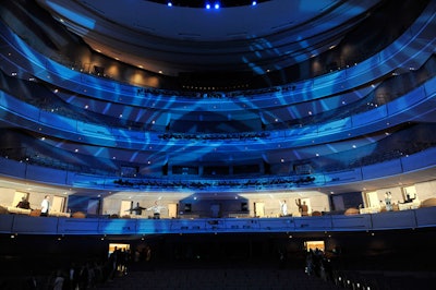 The National Ballet's resident lighting designer, Christopher Dennis, filled the auditorium with blue light and images of clouds as guests arrived to eat dinner on the stage.