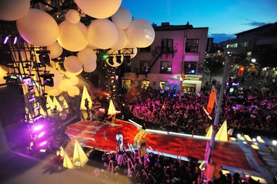 Oversize white balloons hung above the John Street stage, which had a long red runway and cones that lit up throughout the show.
