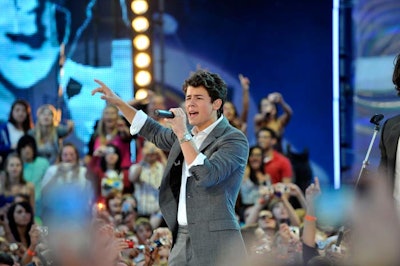 Award co-hosts Jonas Brothers opened the show with a performance of their song 'Burnin' Up.'