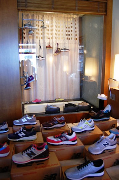 New Balance shoes topped the bed and hung inside the shower in a suite at the Artist Sanctuary.