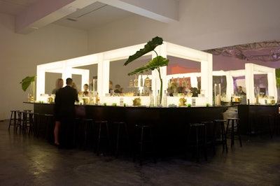 The evening's central bar was illuminated and seemingly multidimensional, thanks to a wall of mirrors in the background. Event sponsors Belvedere and 10 Cane rum offered specialty cocktails throughout the night at all three bars.