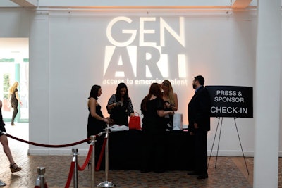 New Image Productions projected Gen Art's logo onto the wall behind the press check-in desk.