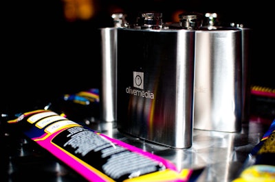 Event organizers placed flasks with logos on tables for guests to take home.