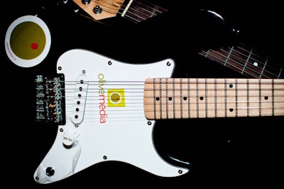 The company's logo covered a range of items throughout the venue, including a guitar.