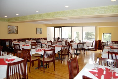 The second-floor private dining room, which seats 60, opens onto a veranda.