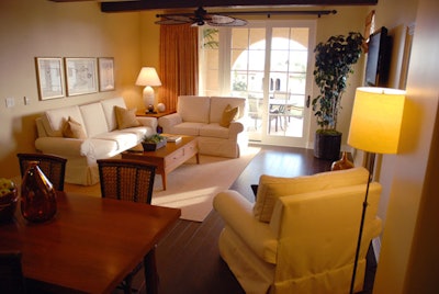 Plush seating and a casual ceiling fan decorate a casita great room.