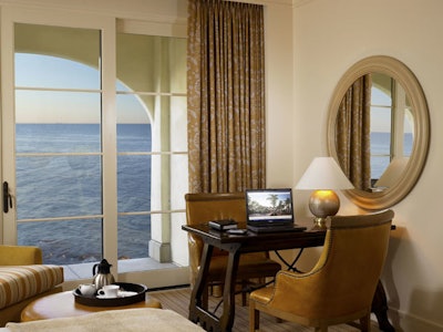 A guest room workstation provides ocean views.