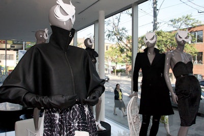 Holt Renfrew styled mannequins in the selected designers' clothing and accented the fashions with paper masks and shoes.