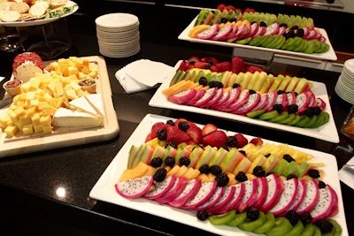 Displays in the presentation centre's kitchen included a spread of cheese, crackers, fruit, and vegetables.