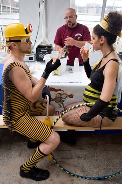 Costumed bee enthusiasts tried samples of honey wine at one of the many tasting stations.