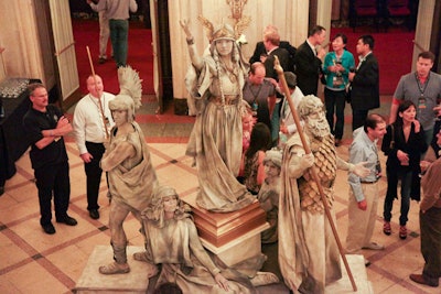 Models posed as Greek and Roman statuettes matched the Wang Theater's opulent lobby.