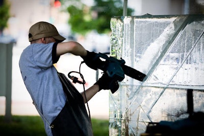 An artist from Richmond, Virginia-based Ice Sculptures Unlimited chiseled a six-foot K, representing the capital K in the Cricket logo.