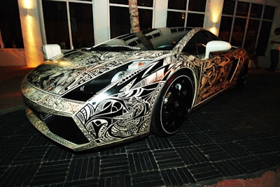 A graffitied Lamborghini parked in the hotel's driveway drew attention to the event.