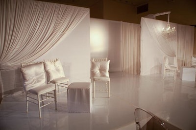 Event Creative set up white lounge furniture at the end of the runway.