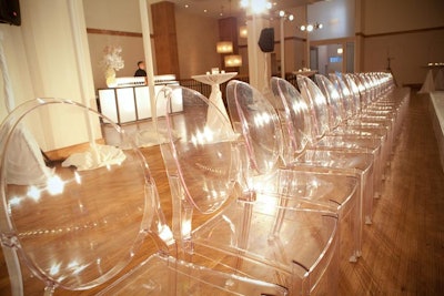 Approximately 50 guests watched Sunday night's hair show from Lucite chairs.