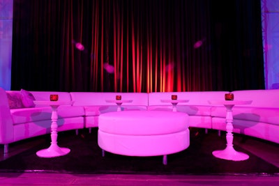 A curved white couch from Contemporary Furniture Rentals provided seating in the lounge area at the gala.