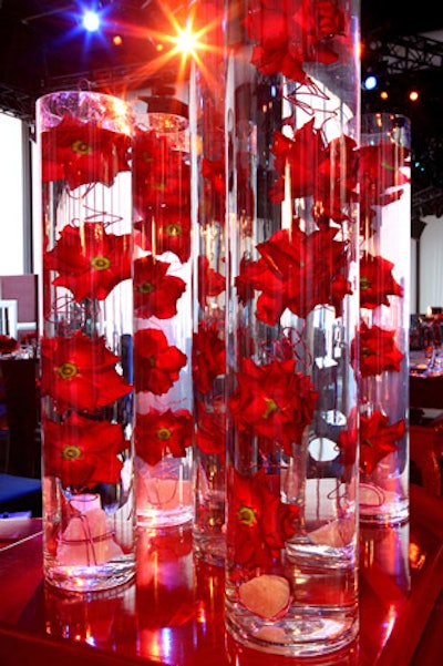 Roses were suspended in clear glass vases.