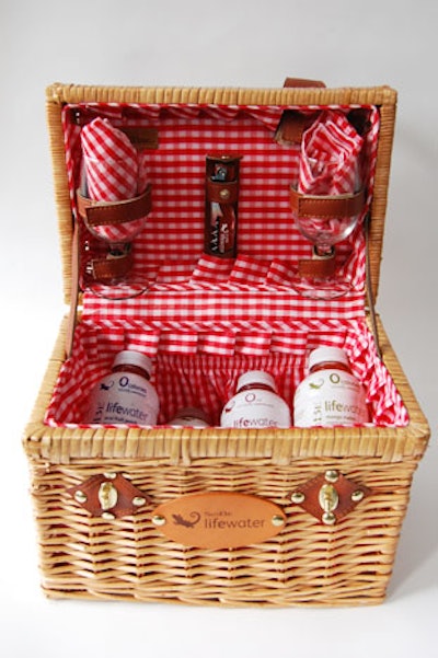 The invitation arrived in a leather-clasped wicker basket lined in red gingham, containing four varieties of SoBe Lifewater, two branded wine glasses, and a bottle opener.