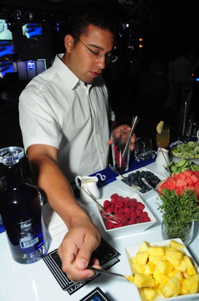 Guests muddled their own cocktails at a bar stocked with ingredients such as cucumbers, berries, and fresh pineapple.