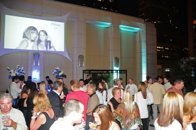 On the Peninsula's terrace, a projection screen showcased photos of guests holding Ultimat drinks.