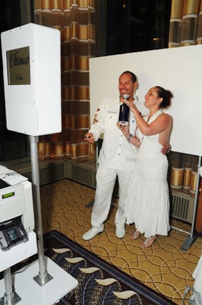 In the ballroom, guests posed in a black-and-white image booth from Mark Van S photography; photos were printed out immediately as takeaways.