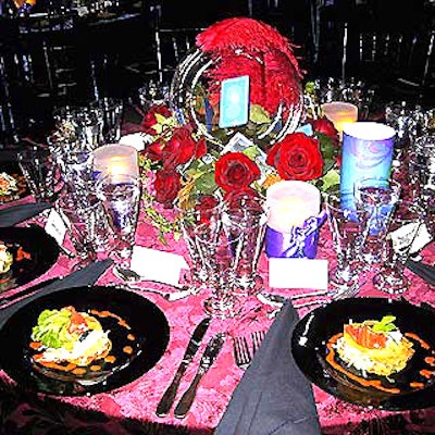 Some of Matthew David's interesting centerpieces featured fan-powered creations that made single tarot cards toss around inside the clear globes. Fluffy red feathers were draped over the tops of the globes, and red roses and waxy green leaves with more tarot cards stuck inside surrounded them.