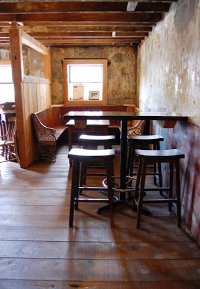 Old church pews and handmade tables—constructed by pub owner Patrick McMurray—fill the cottage room.