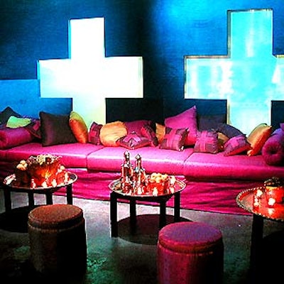 At Travel & Leisure's lavish 30th anniversary party at Milk Studios, a room inspired by the passion of travel was decorated with fuschia seating and cocktail tables with gold trays, votives and metal bowls filled with fruit. (Photo courtesy of Tentation)