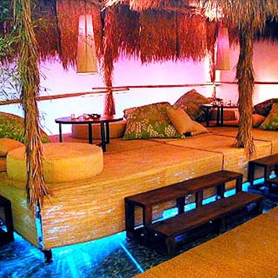 Merv Griffin Productions' decor designs also included a Survivor-style room with thatched roof huts, straw rugs, bamboo, rattan furniture and giant green and tan pillows. (Photo courtesy of Tentation)