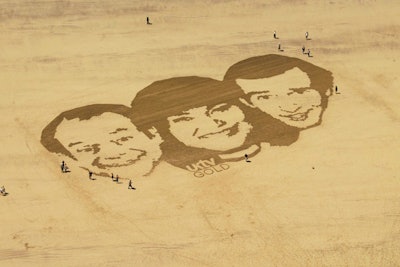 Staffers raked sand to form an ad for television network UKTV.